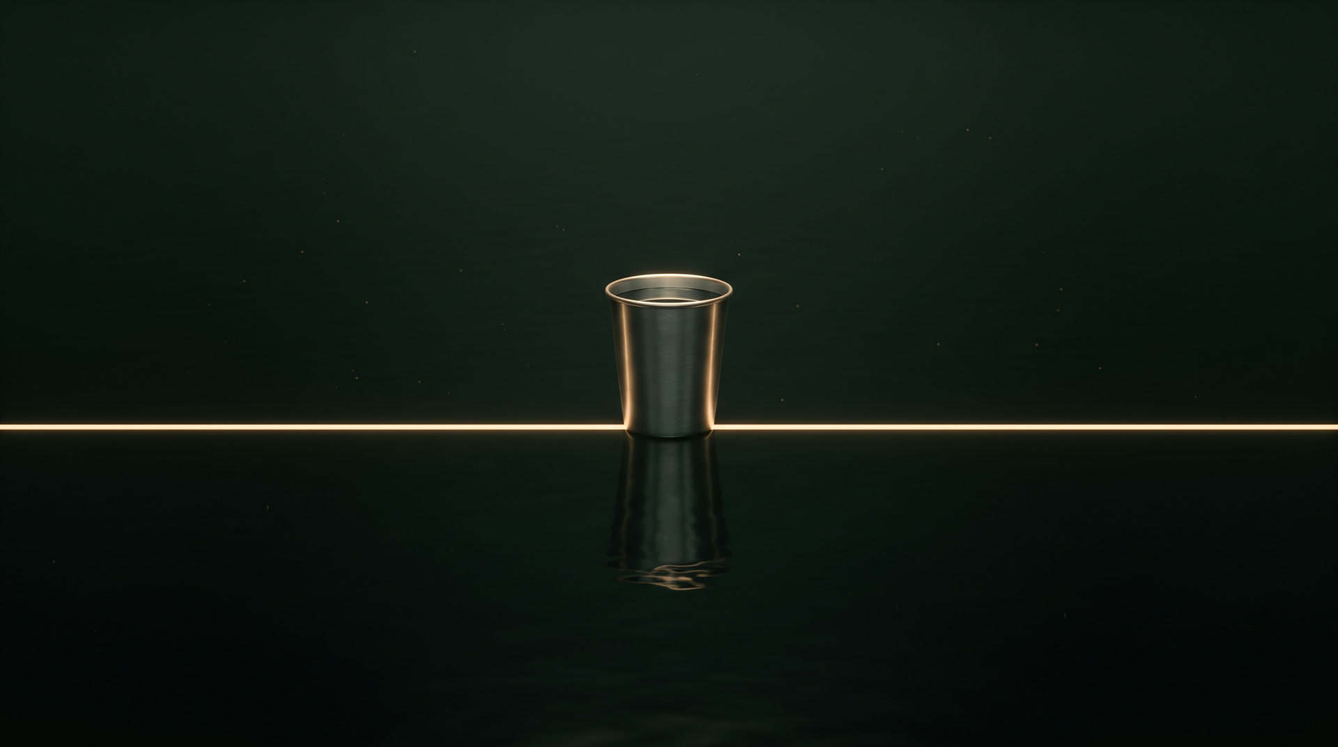 A plain steel tumbler of water standing on the line of light above still dark water.